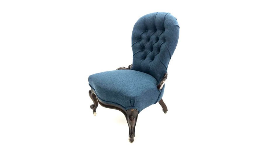 Deep buttoned nursing chair with blue fabric