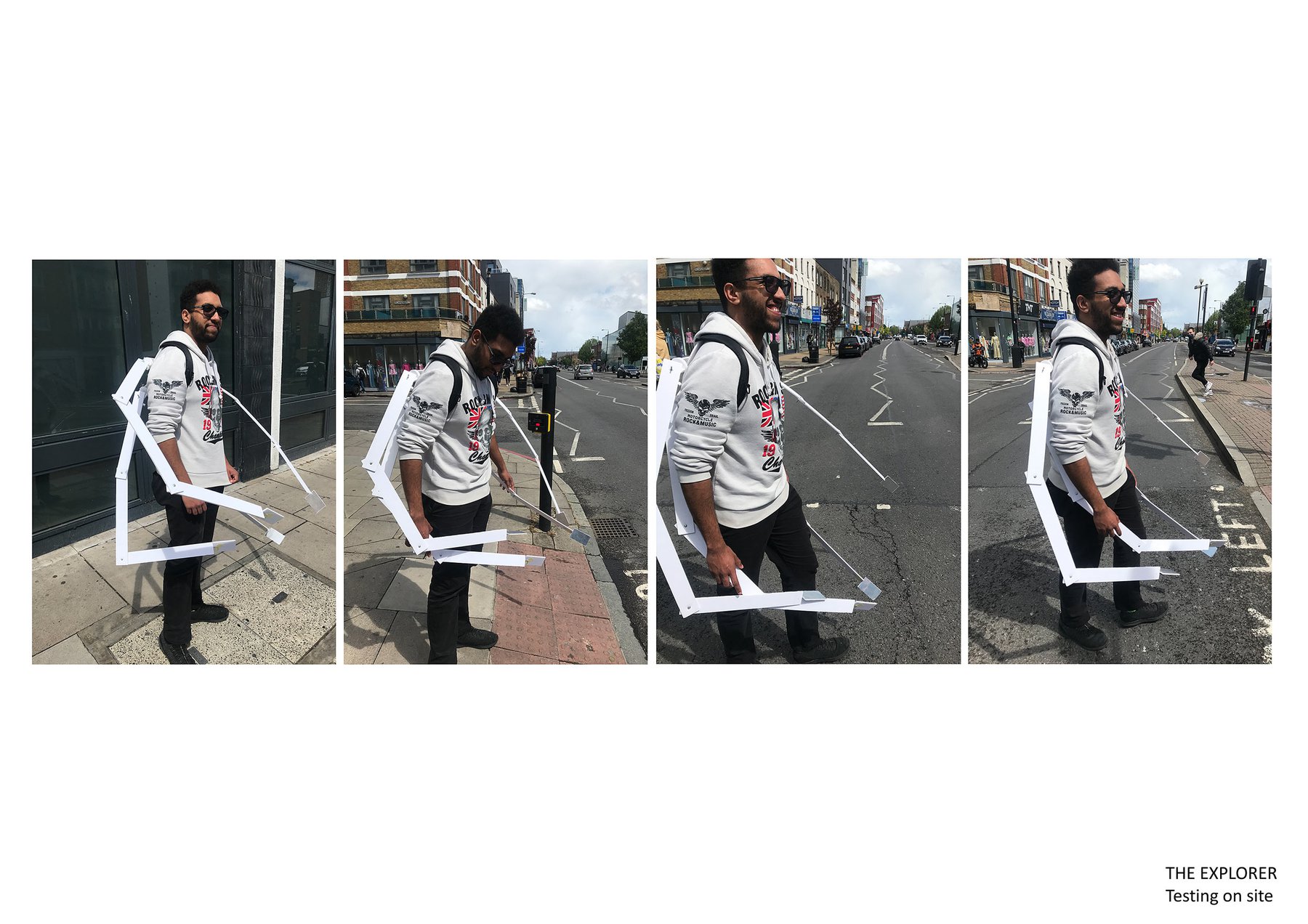 A male model crosses the street in a series of 4 images wearing a white device on their back. The device has multiple arms that flex around the body. It looks similar to the legs of a spider